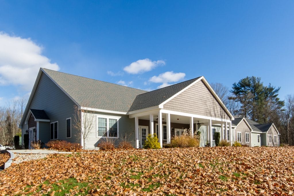 Exterior view of Beaver Lake Lodge with fallen leaves