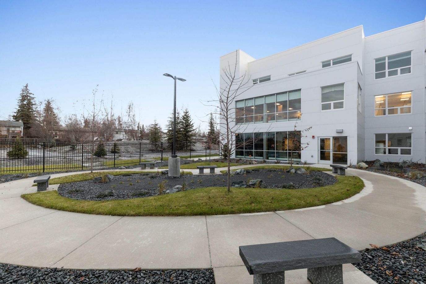 Outdoor courtyard with benches and landscaping