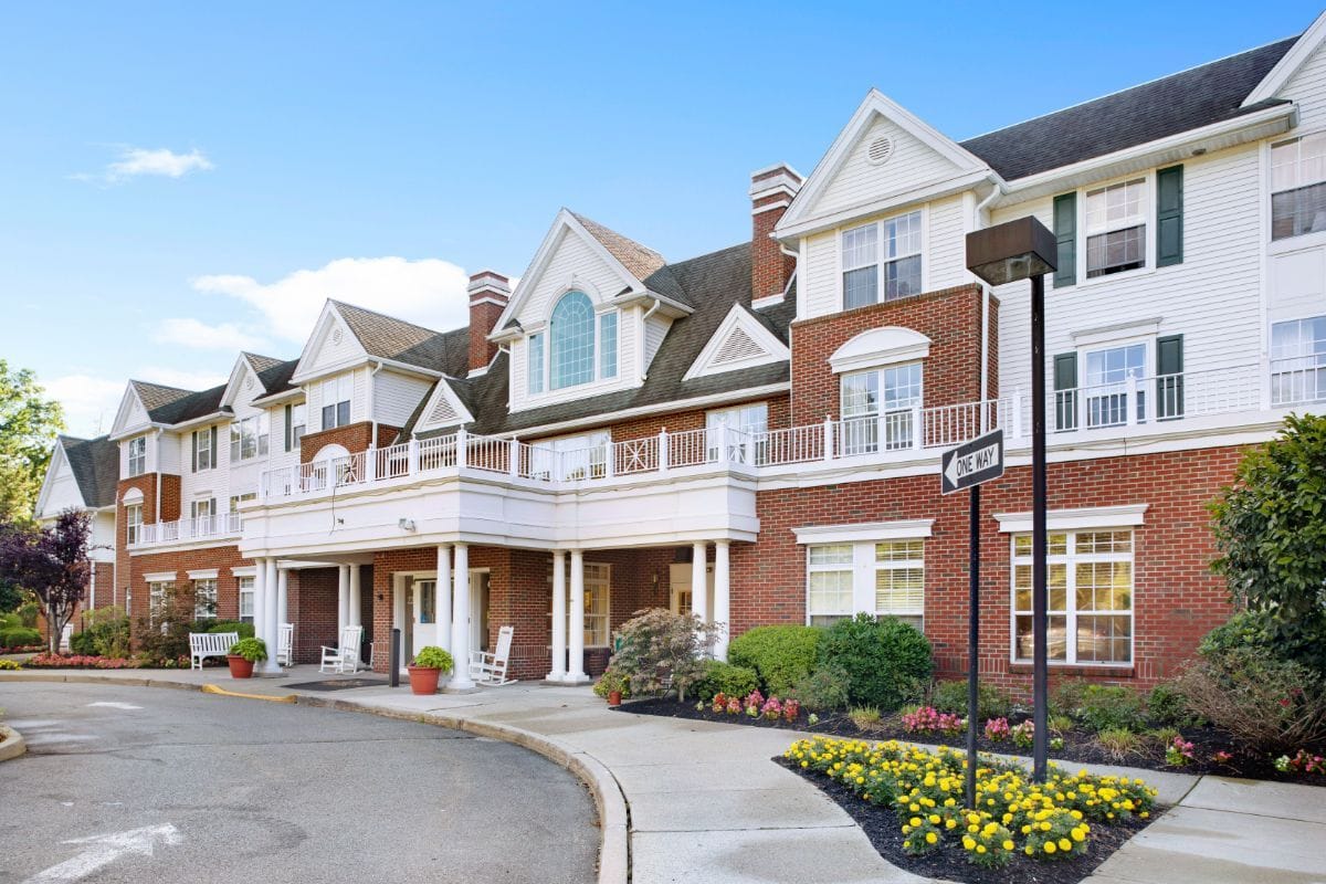 Exterior view of a senior living facility with landscaping