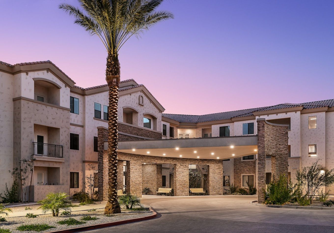 Exterior view of a senior living facility at dusk