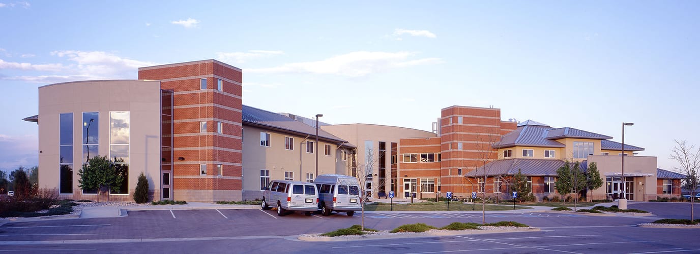 A well-lit exterior view of a nursing home facility