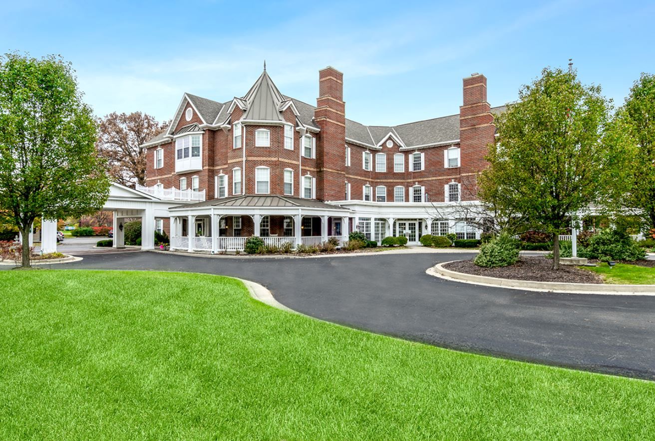 Exterior view of Chapman Place facility with landscaped grounds