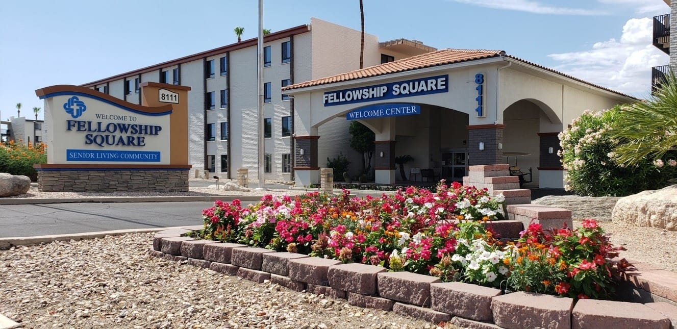 Exterior view of Fellowship Square at Tucson with flowers