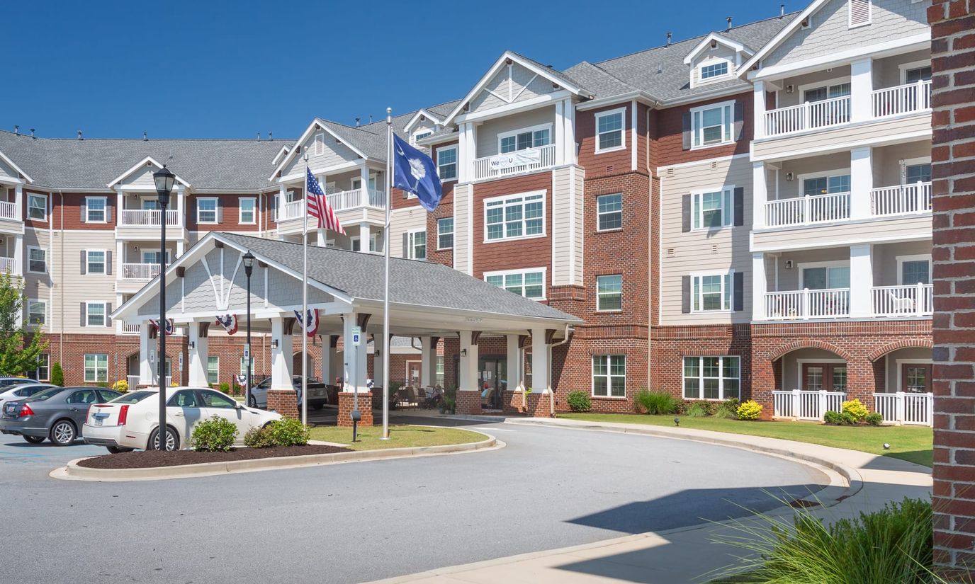 Exterior view of assisted living facility with entrance