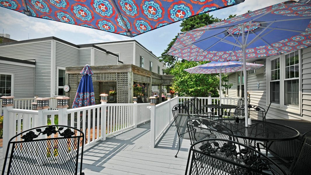 Outdoor patio with colorful umbrellas and tables