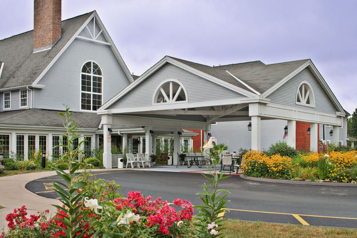 Exterior view of the facility entrance with flowers