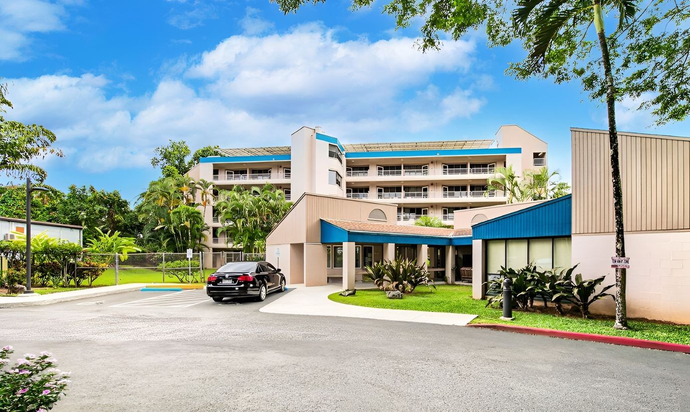 Exterior view of Kaneohe Elderly Apartments with gardens