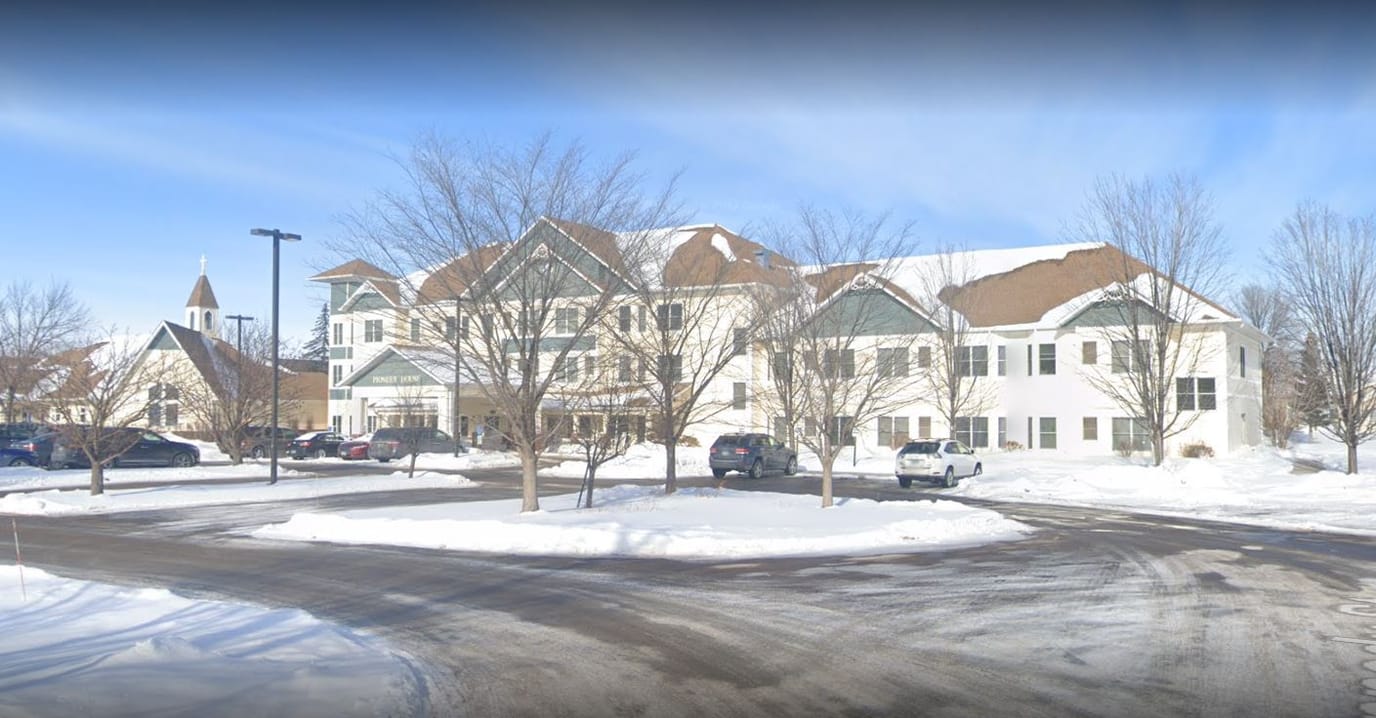 Exterior view of Pioneer House Assisted Living in winter.