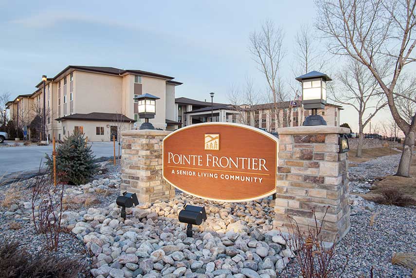 Exterior view of Pointe Frontier senior living community entrance sign