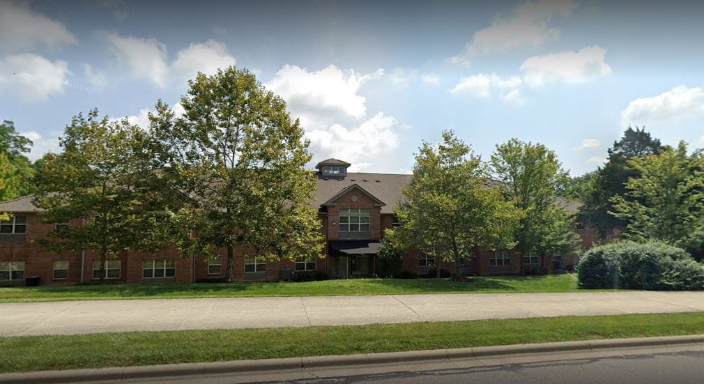 Exterior view of the nursing home surrounded by trees
