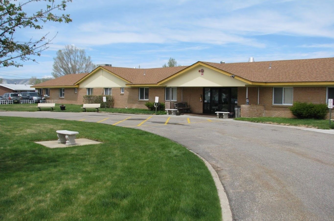 Exterior view of Sage View Care Center with landscaped grounds