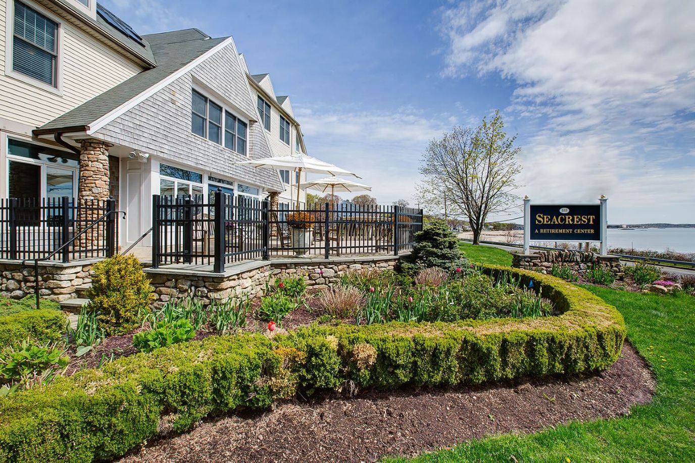 Exterior view of Seacrest Retirement Center with gardens