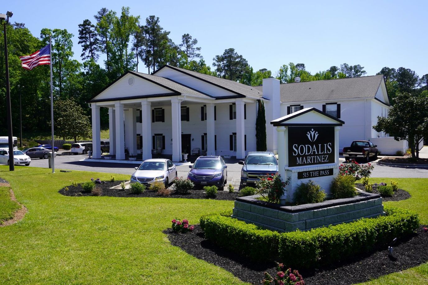 Exterior view of Sodalis Martinez with vehicles.