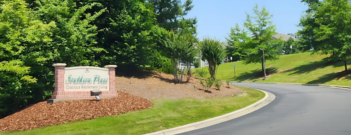 Entrance sign for Southern Pines Gracious Retirement Living