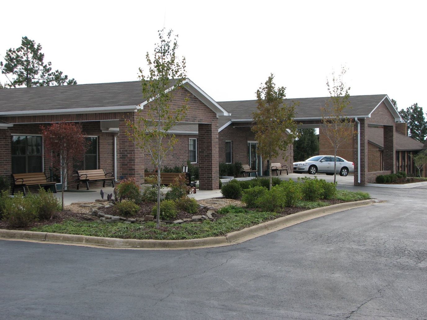 Exterior view of Sunshine Manor facility with landscaping