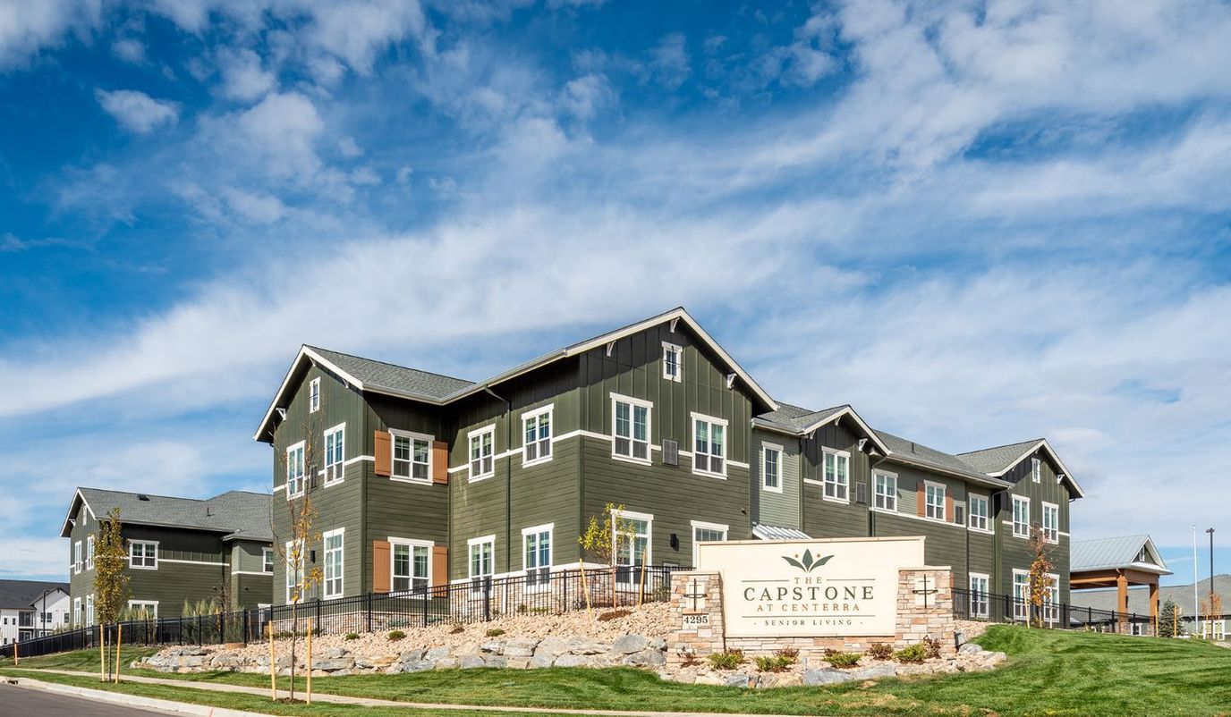 Exterior view of The Capstone at Centerra with signage