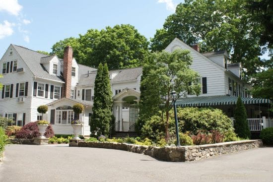 Exterior view of a nursing home facility surrounded by trees