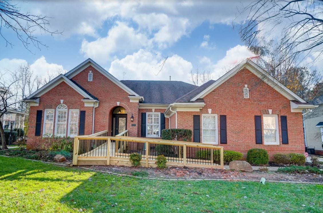 Exterior view of a brick single-story assisted living facility