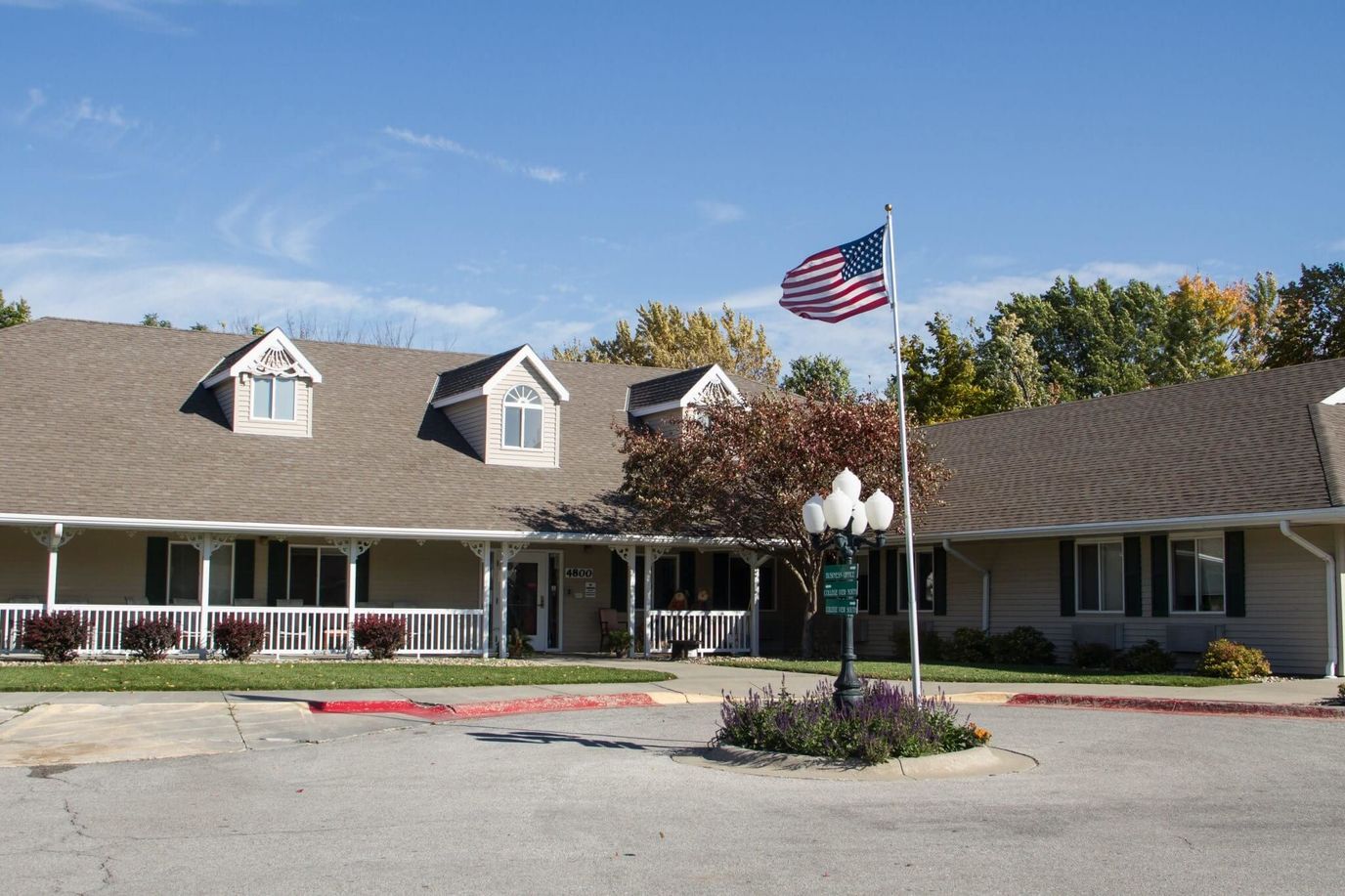 Exterior view of Waterford at College View with flag