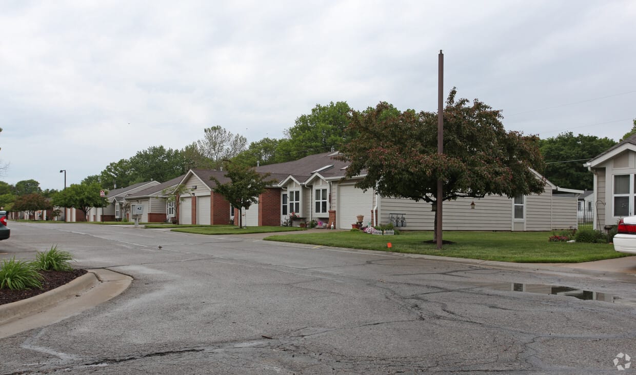 Quiet street view of residential buildings in a senior living community