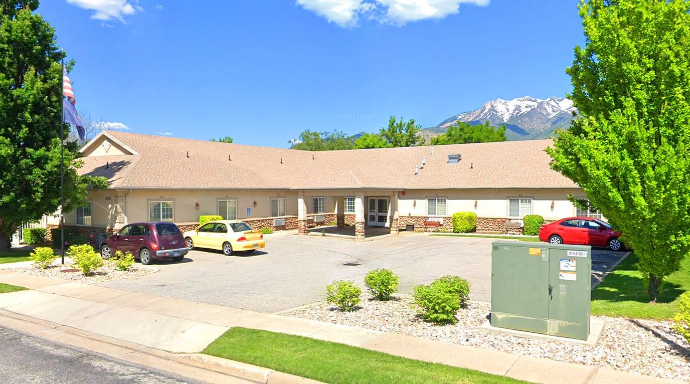 Exterior view of Stoneybrook Assisted Living with landscaped area