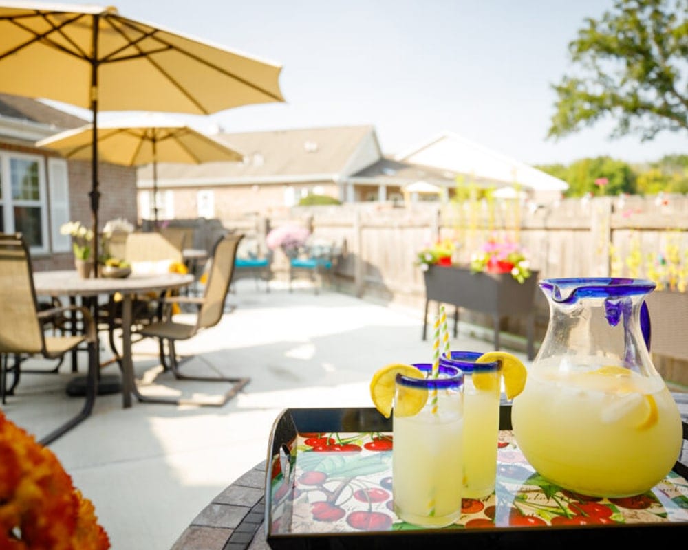 Outdoor patio area with lemonade and people
