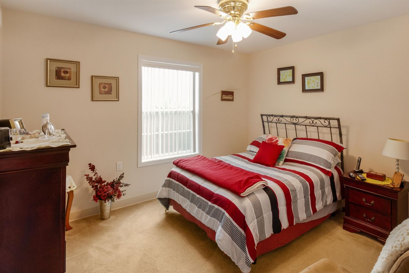 Connect55+ La Vista, independent living in La Vista, NE — Cozy bedroom with a bed, window, and decor