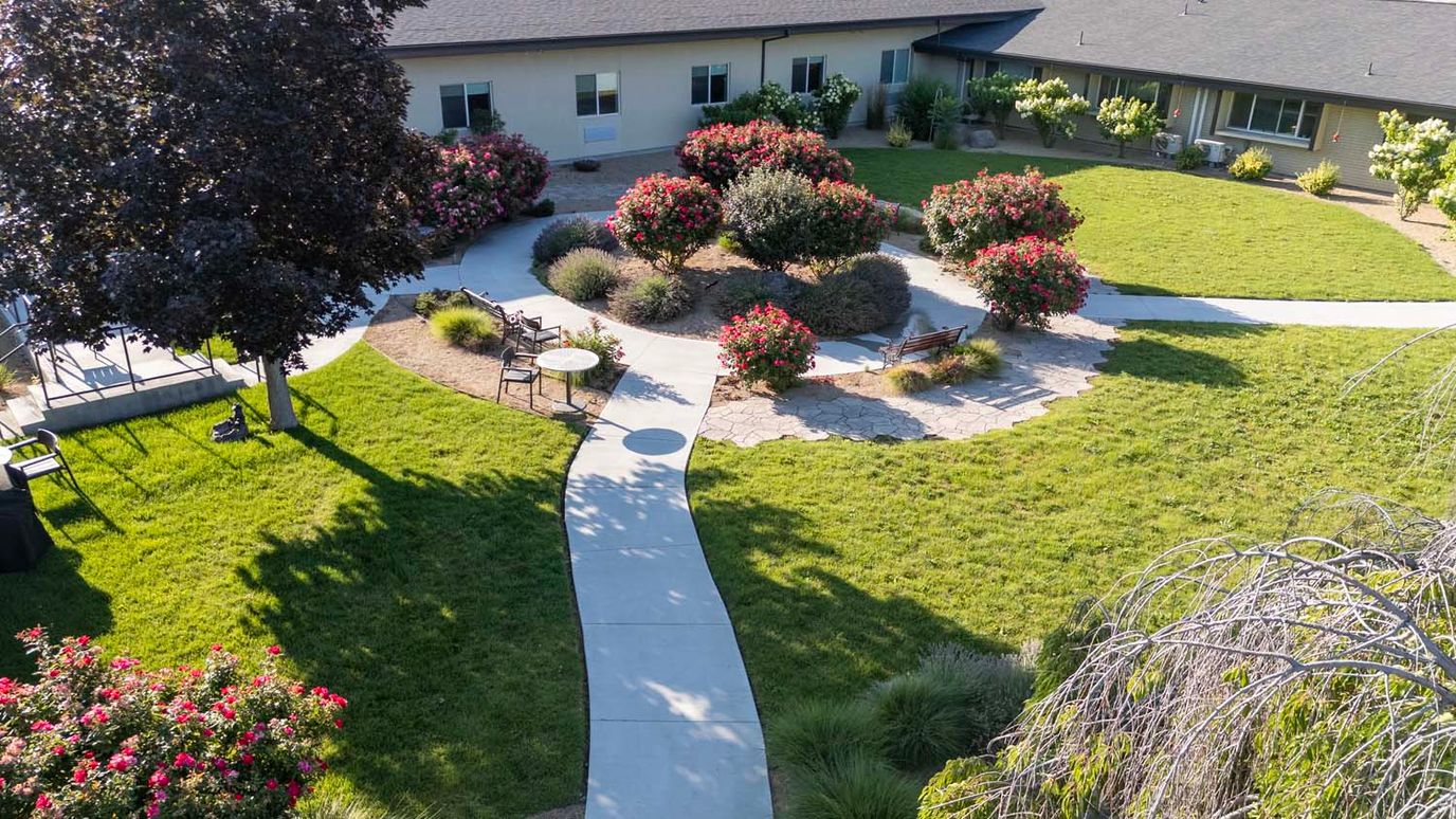 Aerial view of a landscaped garden with walking paths