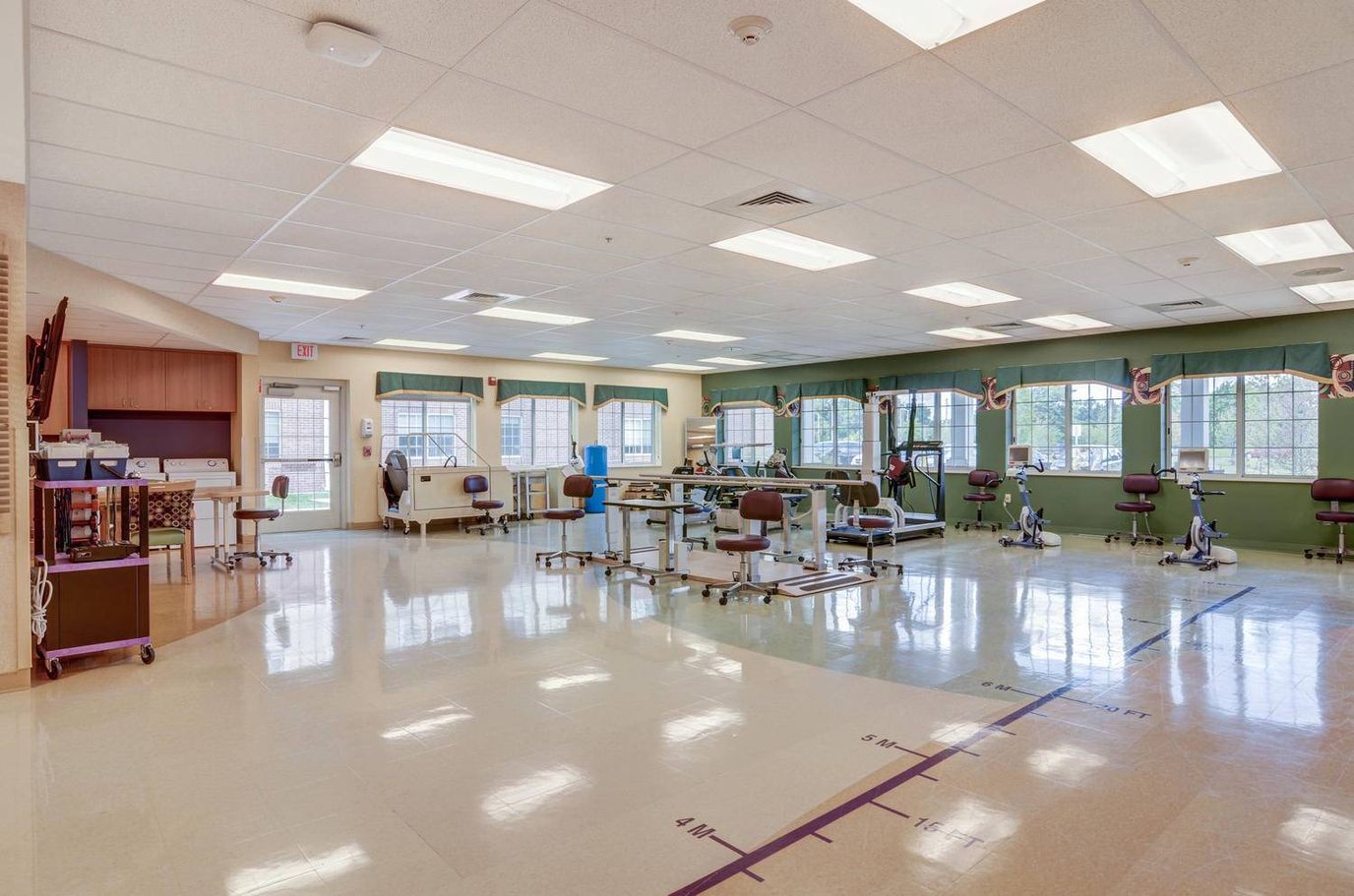 Rehabilitation room with therapy equipment and open spaces