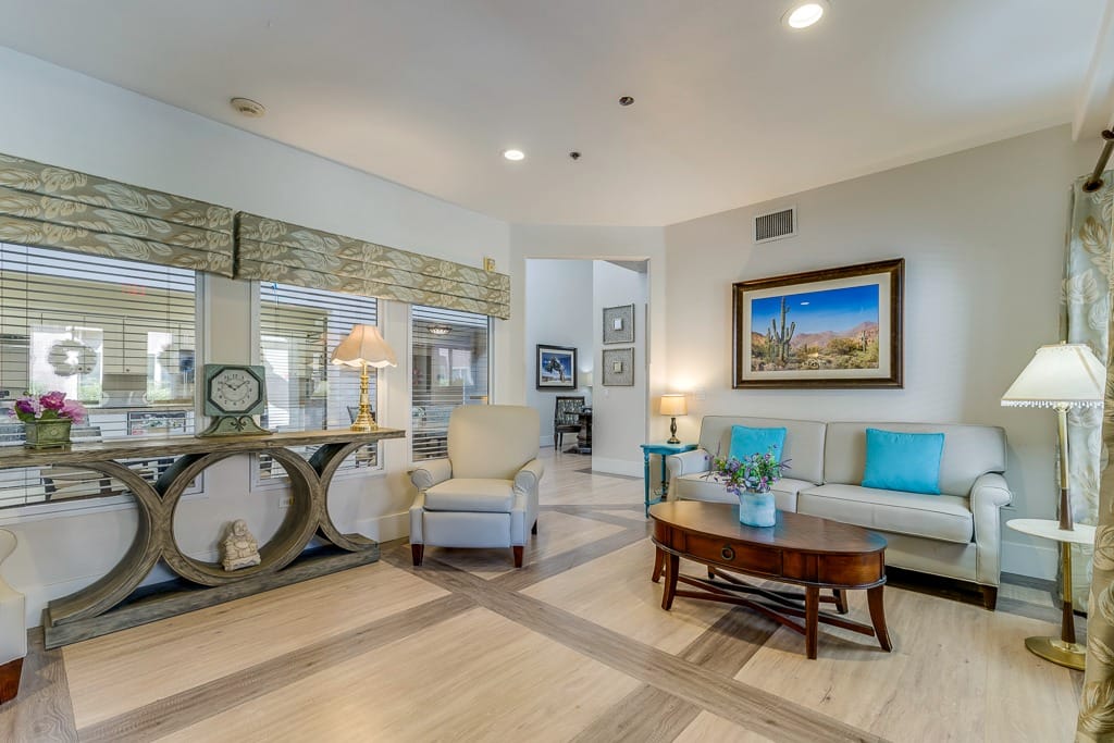 Bright common area with comfortable seating and artwork