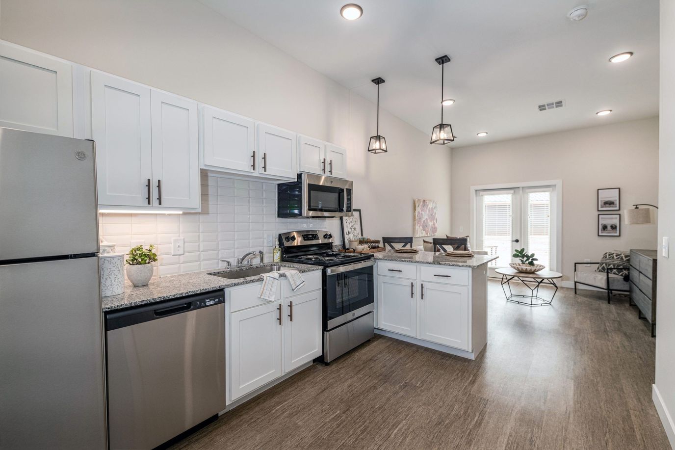 Sooner Station Senior Living, assisted living in Norman, OK — Modern kitchen with stainless steel appliances and white cabinetry