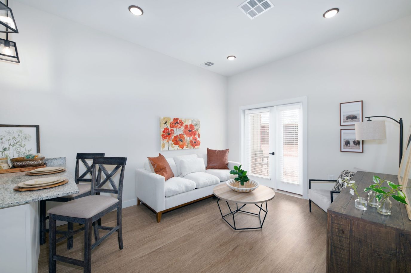 Sooner Station Senior Living, assisted living in Norman, OK — Modern living room with white sofa and decorative accents