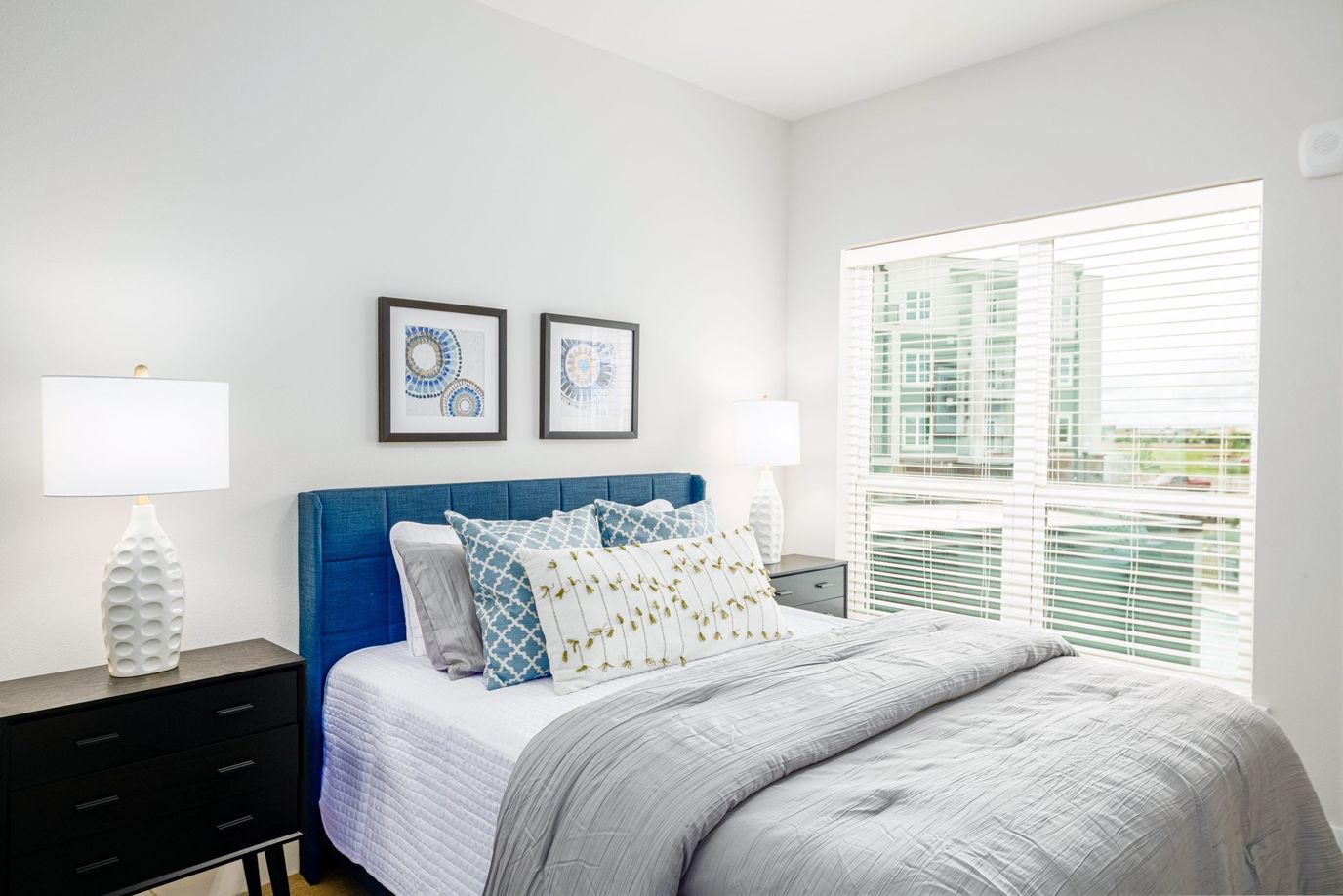 Sooner Station Senior Living, assisted living in Norman, OK — Bright and modern bedroom with window and decor