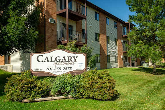 Cooperative Living Center, assisted living in West Fargo, ND — Calgary Apartments sign in front of a residential building
