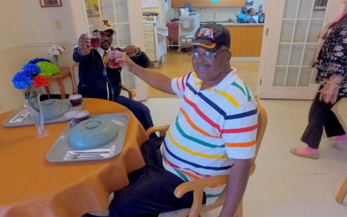 South Heritage Health & Rehabilitation Center, Nursing Home in St. Petersburg, FL — Residents enjoying refreshments at a dining table