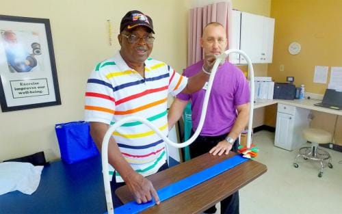South Heritage Health & Rehabilitation Center, Nursing Home in St. Petersburg, FL — Senior health rehabilitation session with therapist and resident