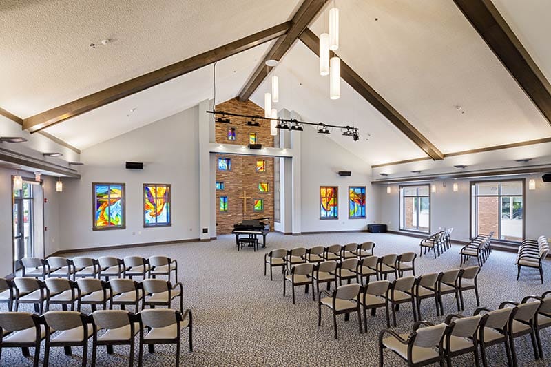 Bright interior of a common area with colorful stained glass