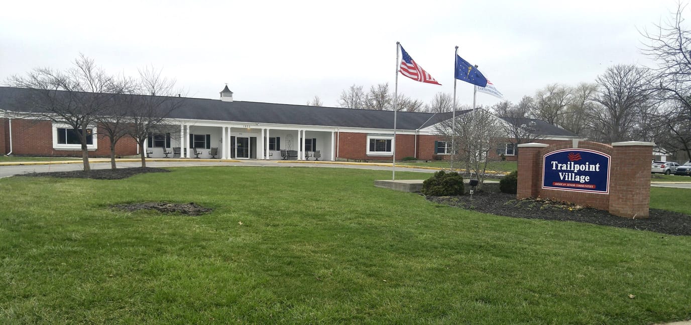 Exterior view of Trailpoint Village residence with signage