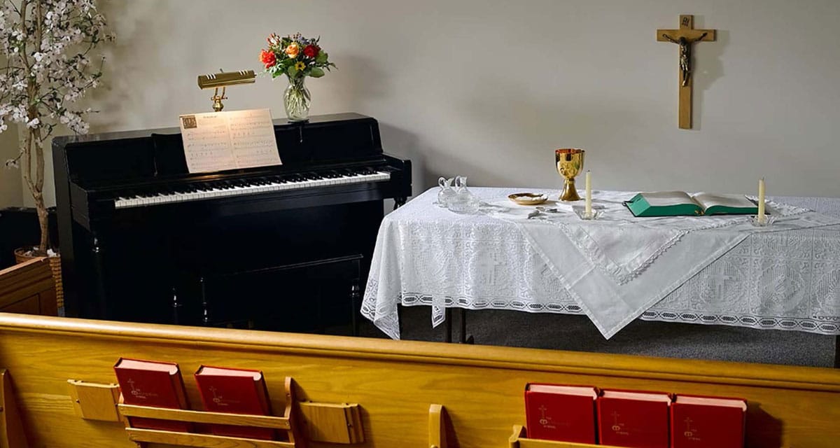 Prayer altar with piano and candles in a serene setting