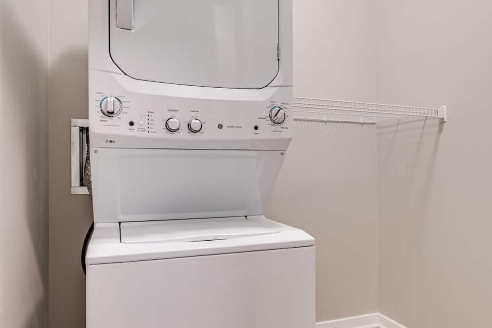 Stacked washer and dryer in a laundry area