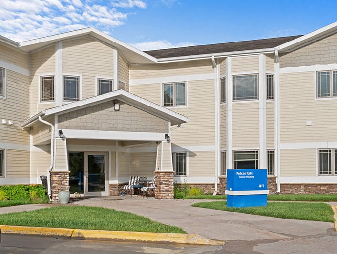 Good Samaritan Society – Grand Island Village, Nursing Home in Grand Island, NE — Senior living facility entrance with landscaped surroundings