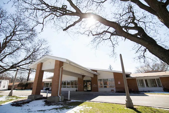 Exterior view of the nursing facility with trees