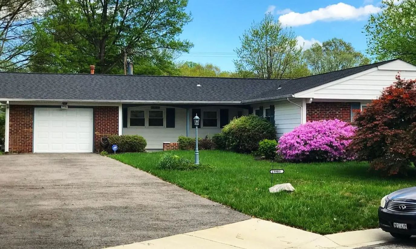 Exterior view of a single-story residence with landscaping