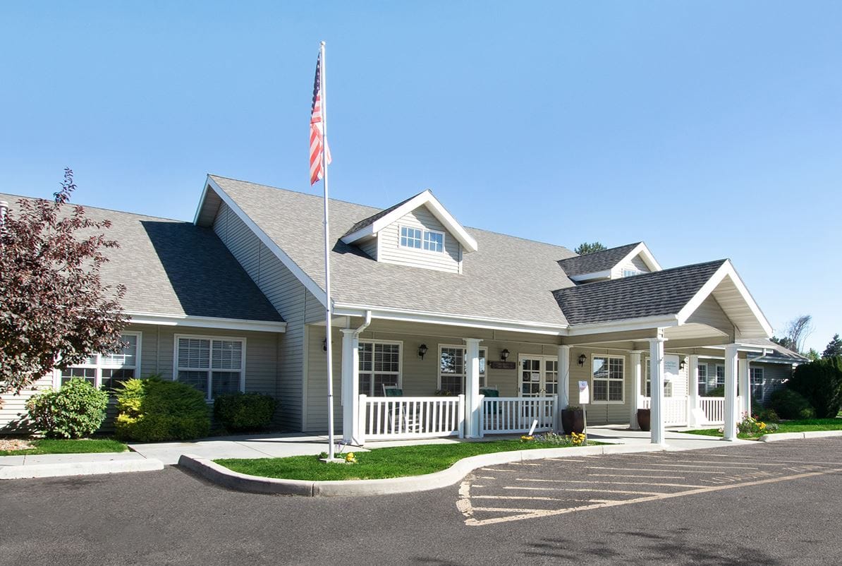 Exterior view of Annabelle House with flag and landscaping