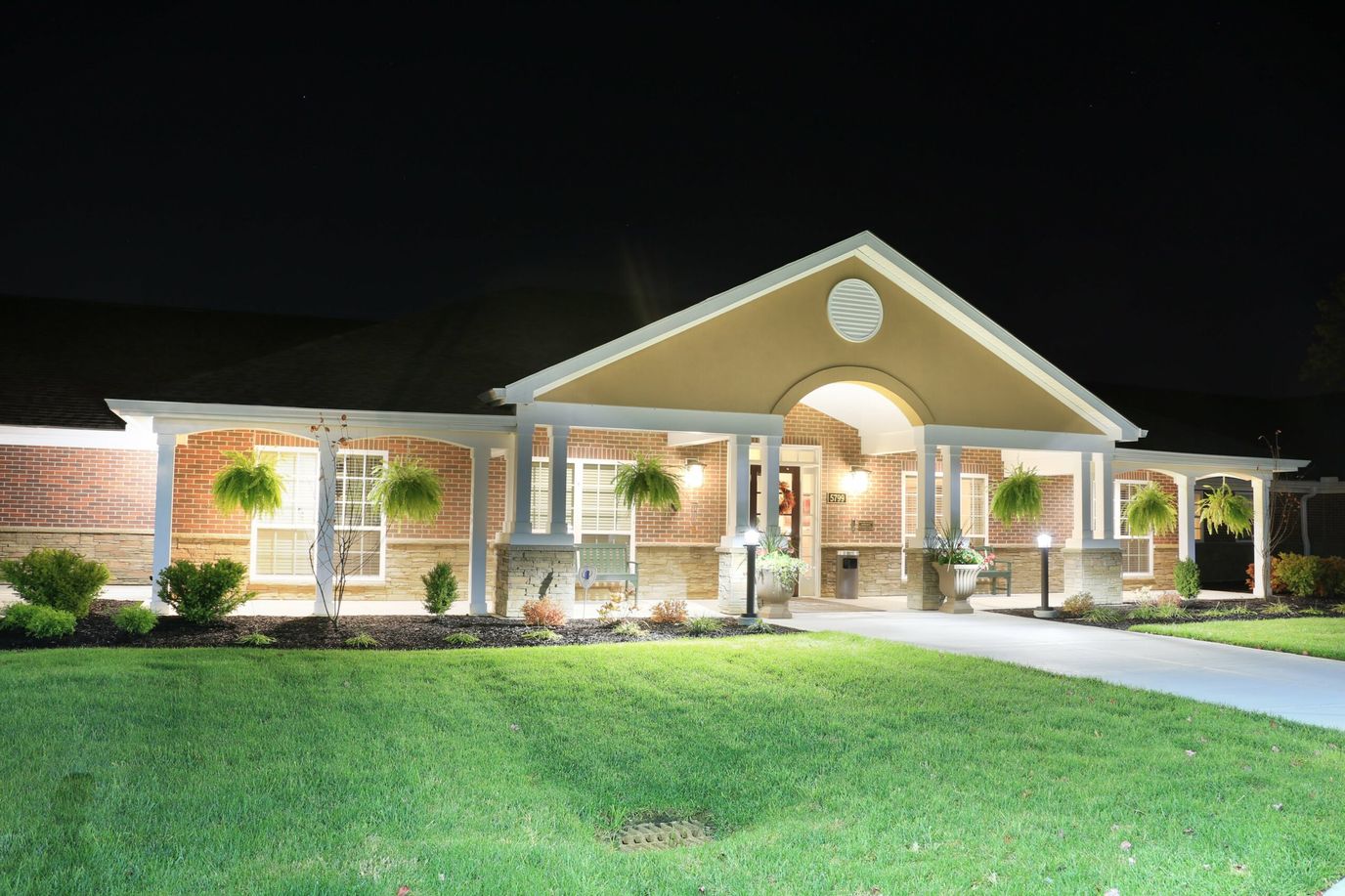 Exterior view of Artis Senior Living building at night