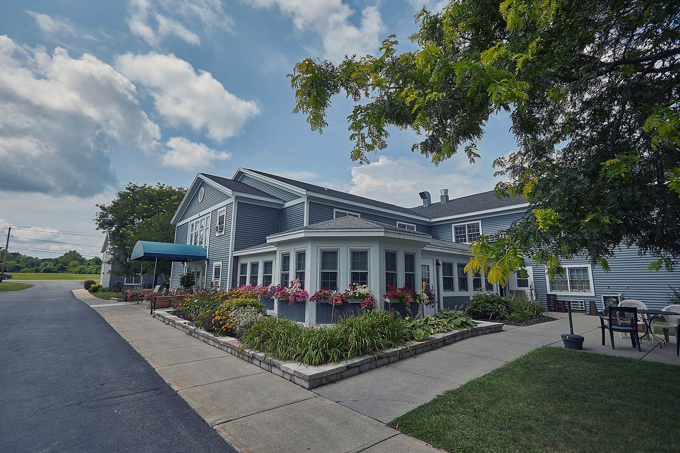 Exterior view of Buckley Landing with flowers and outdoor seating