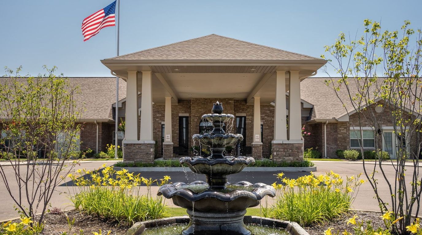 Exterior view of Culpepper Place with fountain and flag