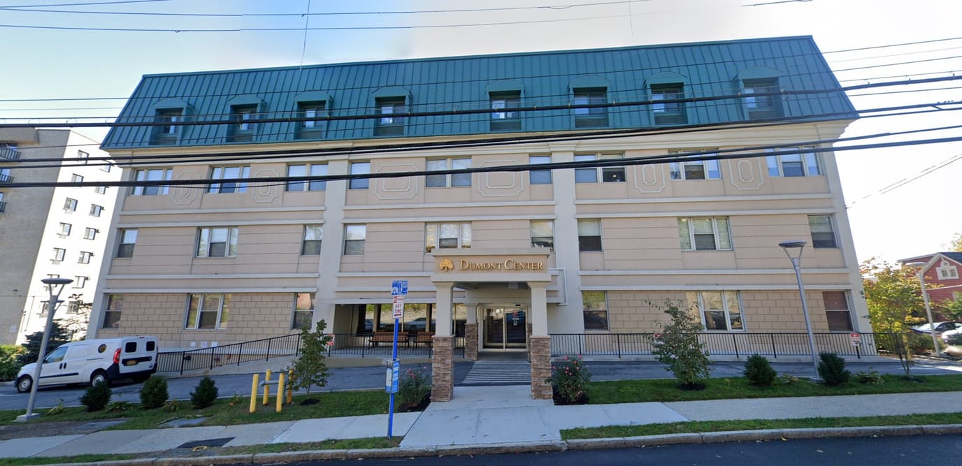 Exterior view of Dumont Center with landscaping