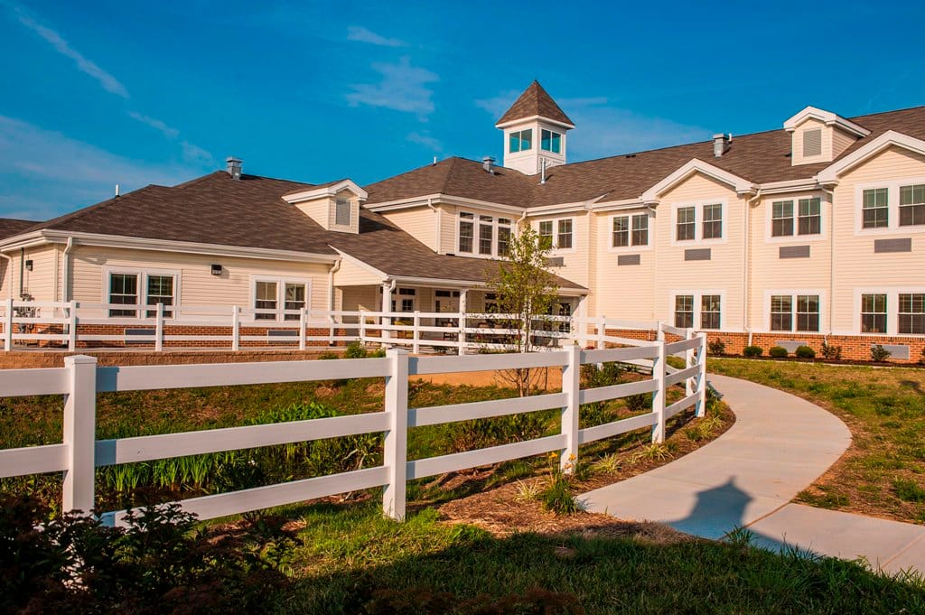 Exterior view of Edenton Retirement Community with pathway
