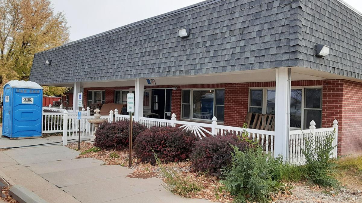 Exterior view of the facility with a porch and landscaping
